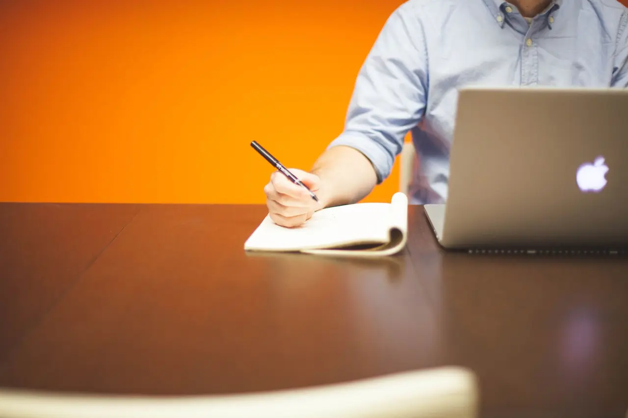 An adult working at a desk